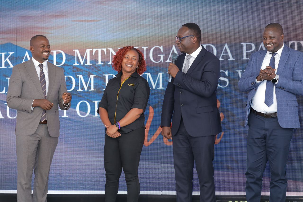 Left-Right: State Minister for Microfinance Hon. Haruna Kasolo, MTN Uganda CEO Sylvia Mulinge, PostBank CEO/MD Julius Kakeeto, and MTN MoMo CEO Richard Yego.